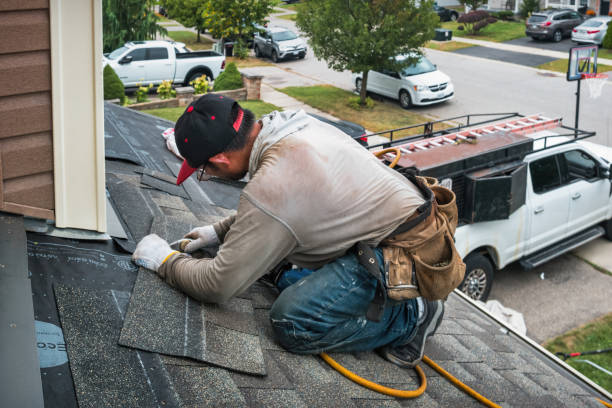 Professional Roofing technician working in Stout, IA